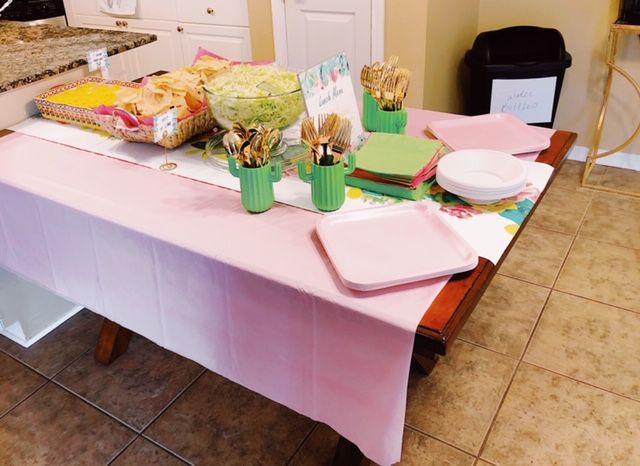 succulent baby shower table with a pink table cloth, cactus utensil holder, colored paper plates and colored napkins | Busy Life Healthy Wife | Navigate your busy life and learn how to start a business