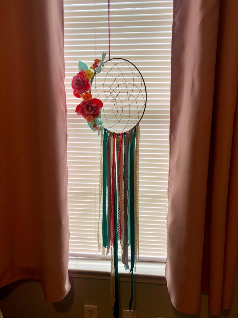 colorful dream catcher hangin in a window with lgiht shinning through - created at a cactus themed baby shower | Busy Life Healthy Wife | How to host the perfect succulent baby shower