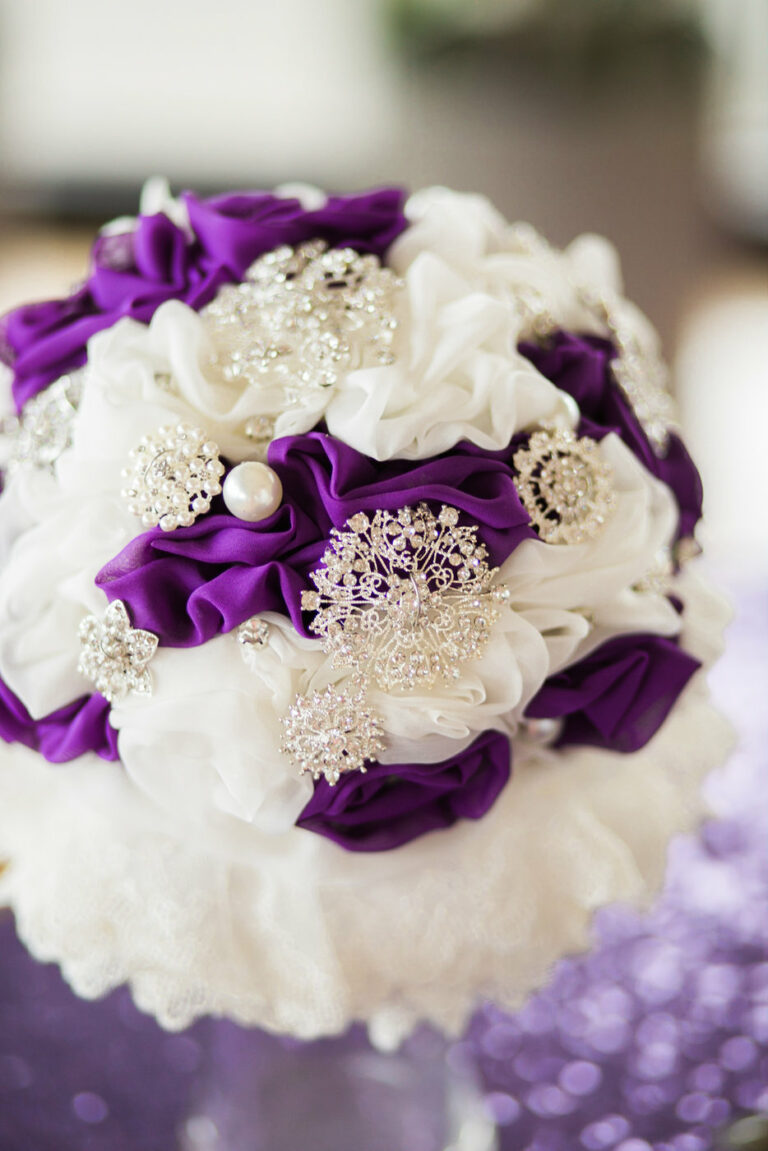 purple and white fake flower bouquet with silver jewelry and filigree and fake pearls for a wedding | Busy Life Healthy Wife