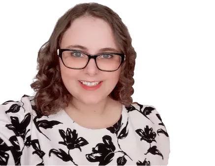 Owner of Busy Life Healthy Wife Monica Anne| has brown curly hair, black glasses, round face, and a white blouse with black flowers | nail down your niche | holisitc business coach